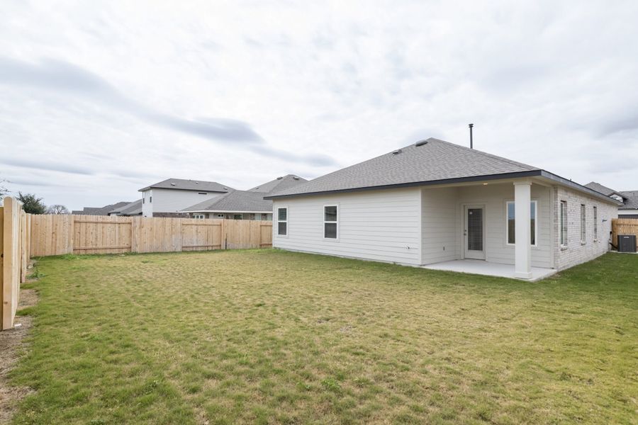 Exterior details and patio area of a home in Village at Three Oaks, Seguin (Image 28).