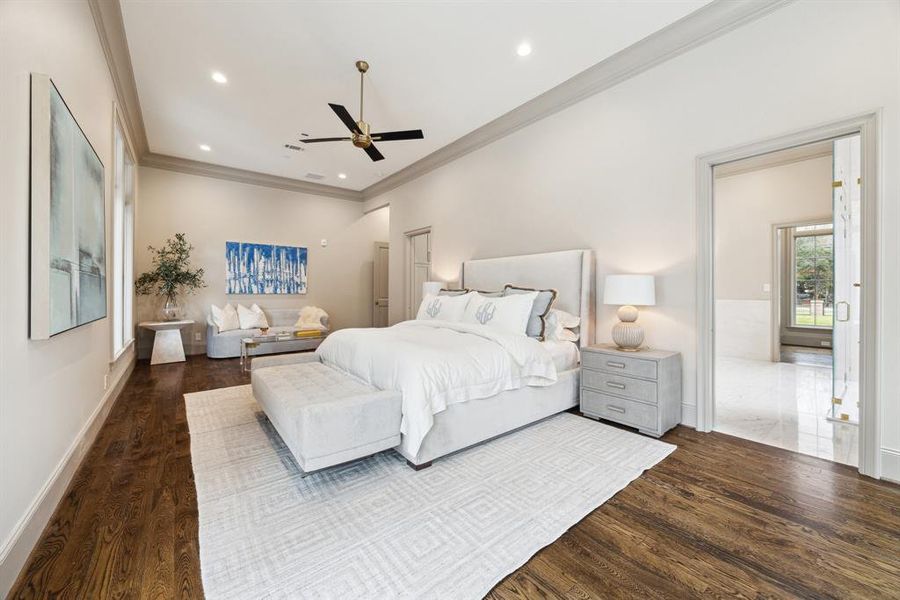 This view of the primary bedroom showcases its generous layout, tranquil atmosphere, and smooth connection to the elegant en suite bathroom, creating an ideal retreat for relaxation and comfort.