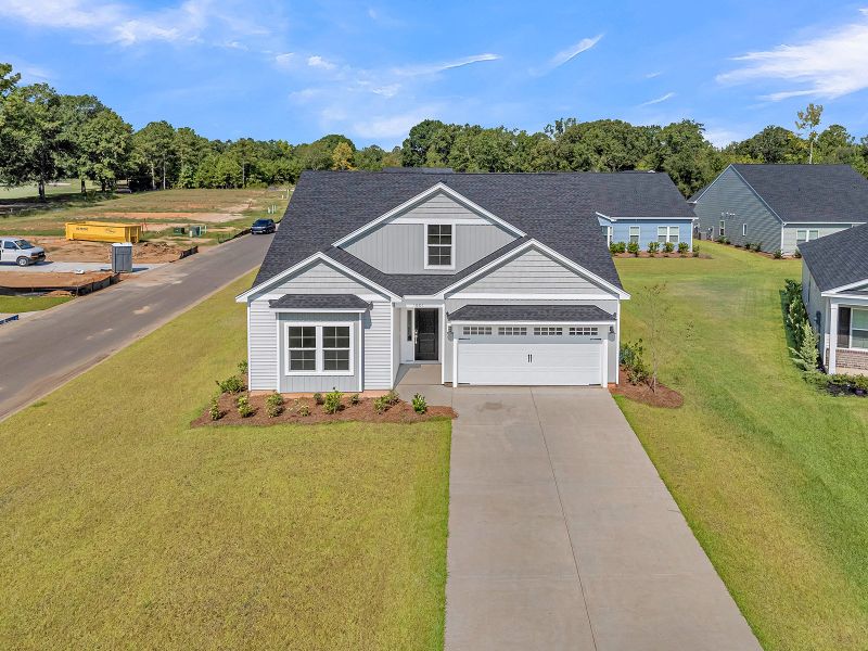 Front exterior of a new home in Fairway Woods at Wyboo, Manning, SC, highlighting curb appeal (Image 25).