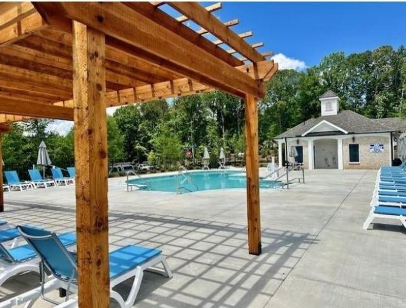 A view of the pool and pergola area. *Please note that pictures shown are of the Jacobsen II floorplan but they are not of the actual home listed.