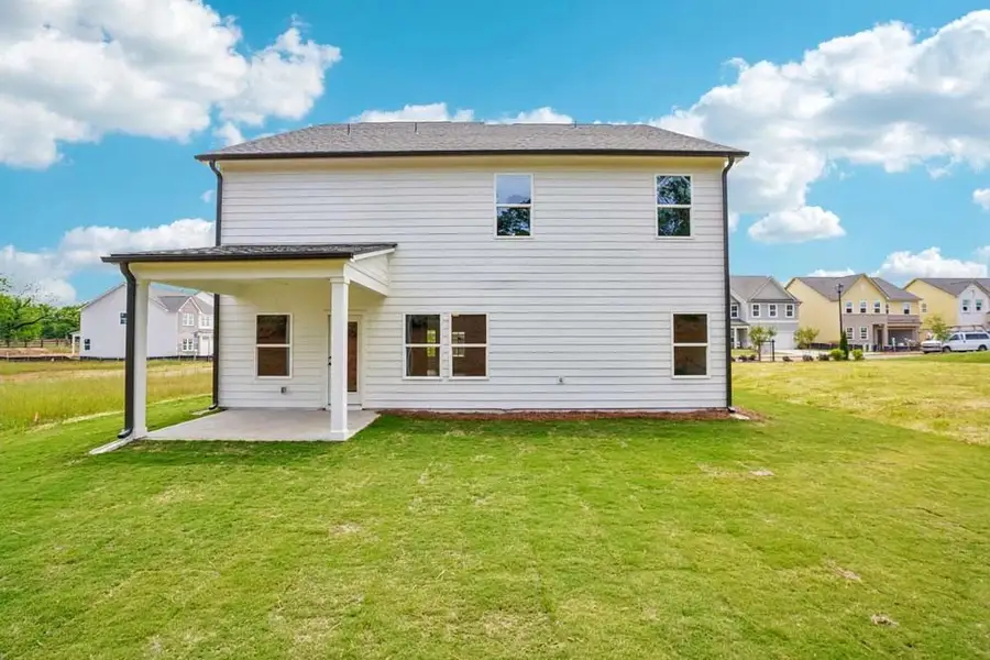Sample Photo: Rear Exterior Featuring Covered Patio