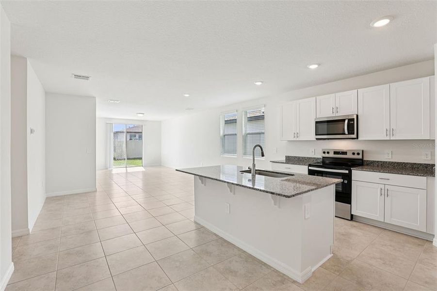 Furnished interior view inside a new home in Lawson Dunes - Signature Series, Haines City (Image 6).