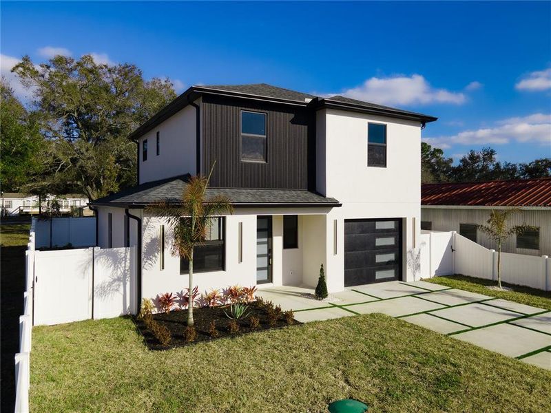 Front exterior of a new home in , Tampa, FL, highlighting curb appeal (Image 28).