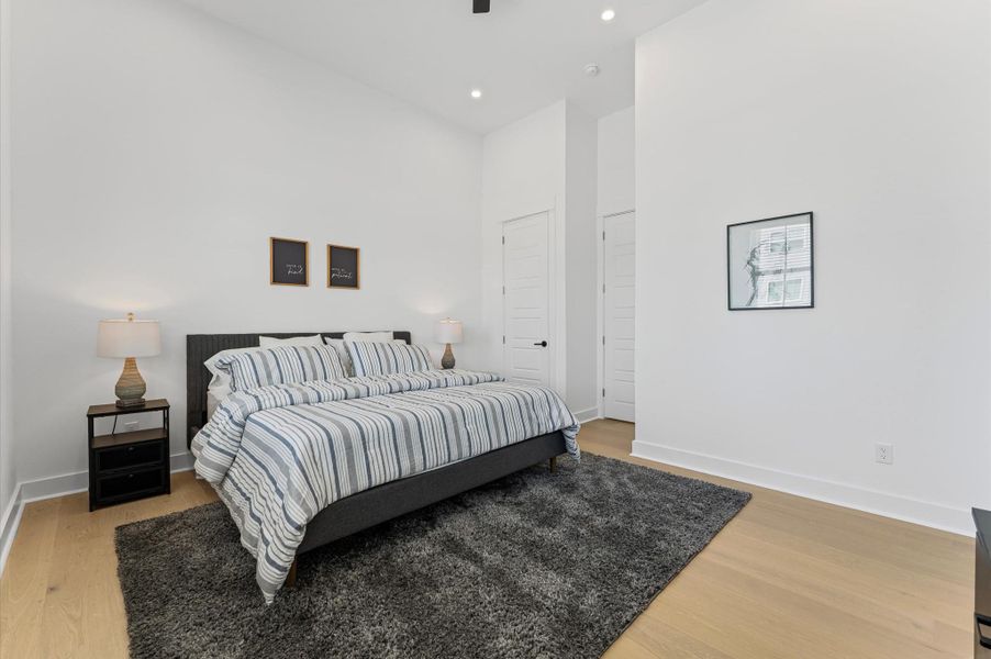 Bright and spacious, the primary bedroom features multiple windows, a large walk-in closet, and a luxurious primary bathroom... your private retreat.