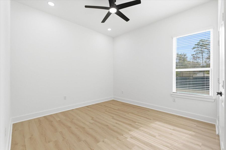 Secondary bedrooms each offer window treatments, luxury vinyl flooring and spacious closets.