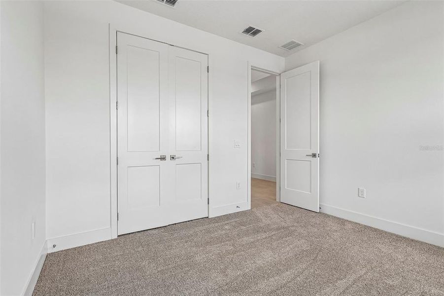 Spacious, unfurnished interior of a new home in Lakeside at Satilla, St. Cloud (Image 18).