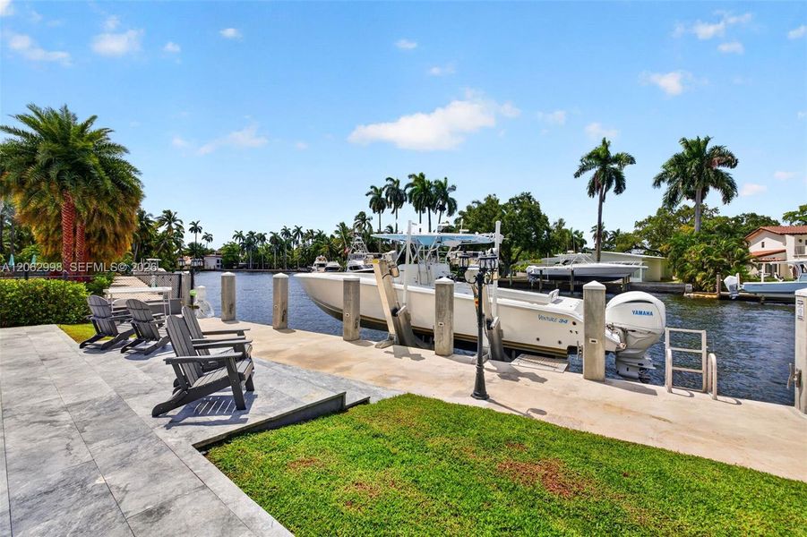 New concrete dock and seawall with 20k electric boat lift, 50 amp electric and water in dock pedestal, fish cleaning station and dock ladder