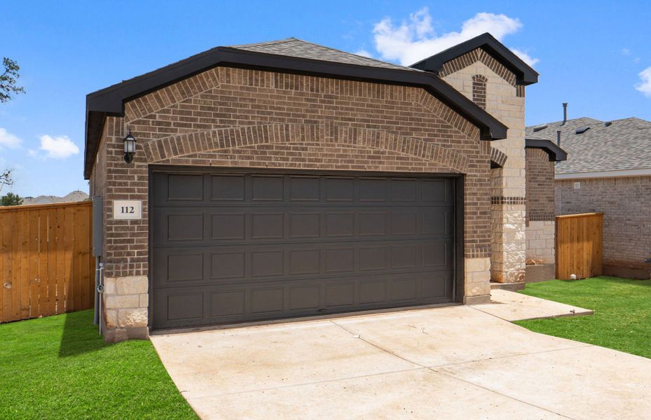 Front exterior of a new home in La Cima, San Marcos, TX, highlighting curb appeal (Image 19).