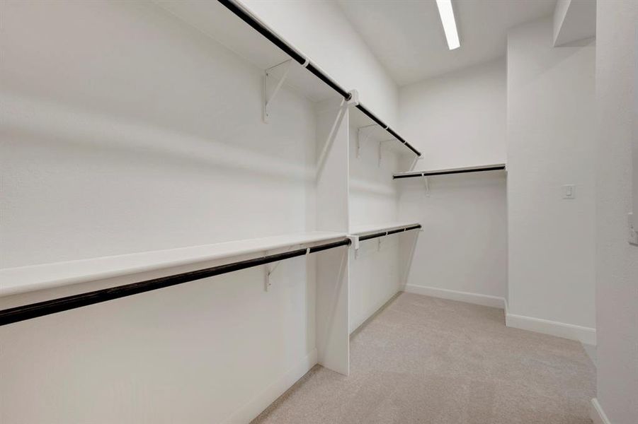 Walk in closet with light carpet Walk in closet with light carpet