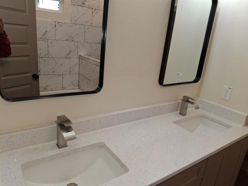 Bathroom featuring double vanity Bathroom featuring double vanity