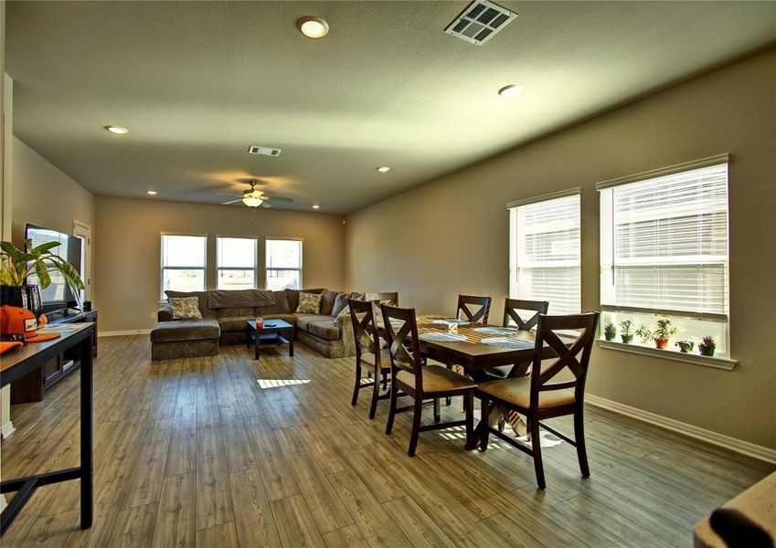 Dining space featuring a ceiling fan, hardwood / wood-style floors, and recessed lighting Dining space featuring a ceiling fan, hardwood / wood-style floors, and recessed lighting