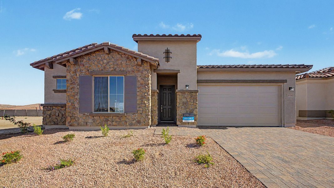 Front exterior of a new home in Arroyo Seco - Hacienda, Buckeye, AZ, highlighting curb appeal (Image 1). Front exterior of a new home in Arroyo Seco - Hacienda, Buckeye, AZ, highlighting curb appeal (Image 1).