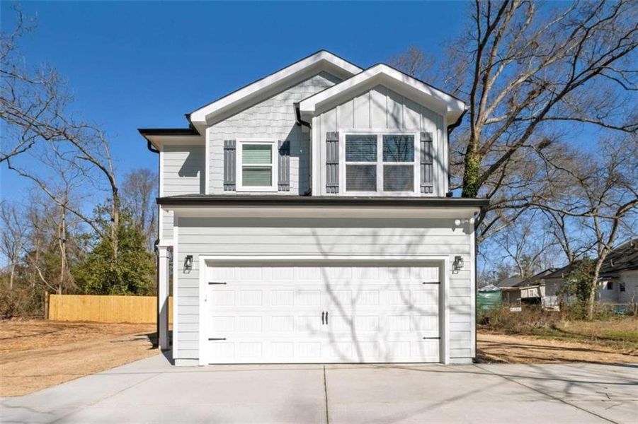 Front exterior of a new home in , Griffin, GA, highlighting curb appeal (Image 24).