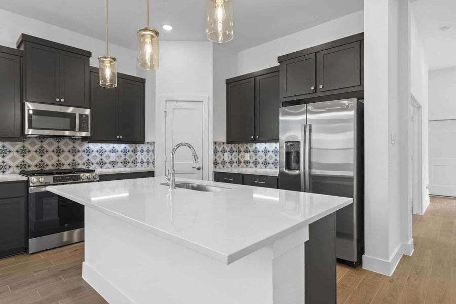 Representative furnished interior of a home built from the Adele by Chesmar Homes in Sunterra, Katy (Image 5).