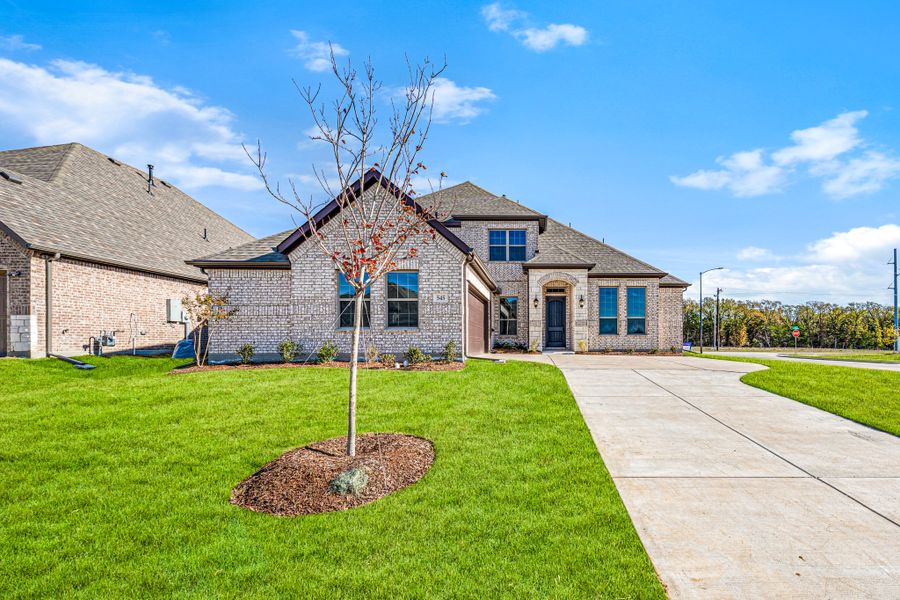 Front exterior of a new home in Forest Ridge Estates, Greenville, TX, highlighting curb appeal (Image 20). Front exterior of a new home in Forest Ridge Estates, Greenville, TX, highlighting curb appeal (Image 20).