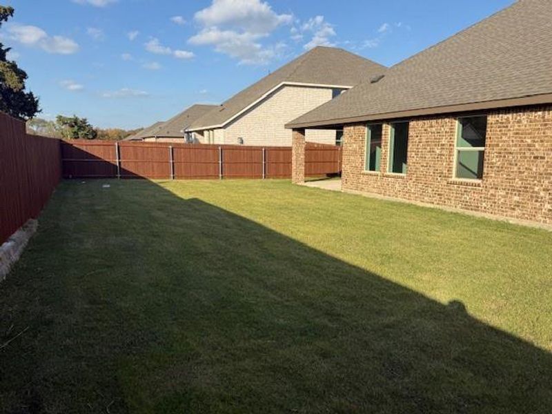 Exterior details and patio area of a home in Fireside by the Lake, Garland (Image 4).