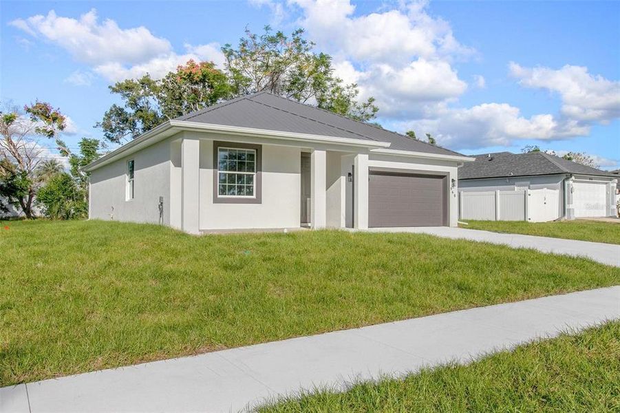 Front exterior of a new home in , Deltona, FL, highlighting curb appeal (Image 15). Front exterior of a new home in , Deltona, FL, highlighting curb appeal (Image 15).
