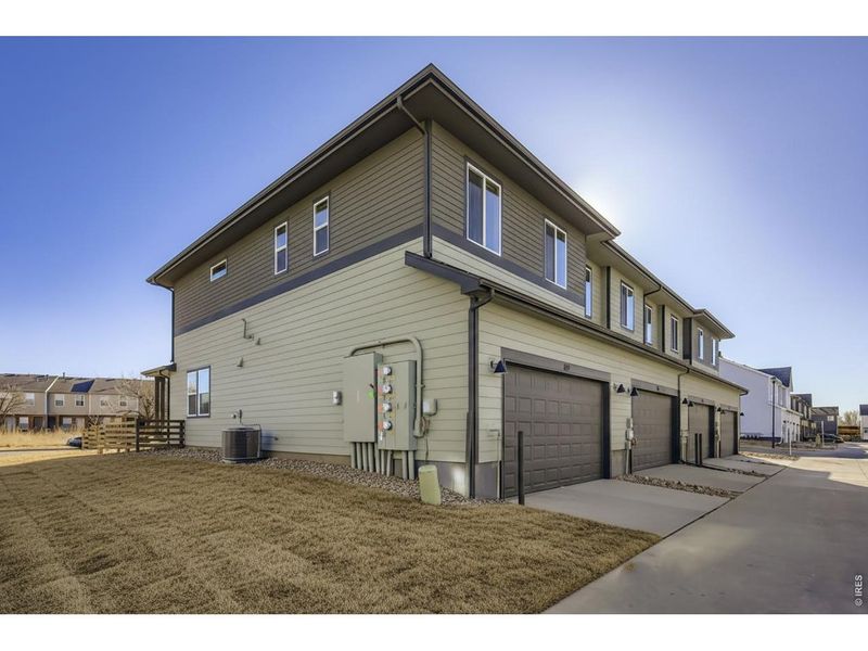 Front exterior of a new home in Waterfield, Fort Collins, CO, highlighting curb appeal (Image 1). Front exterior of a new home in Waterfield, Fort Collins, CO, highlighting curb appeal (Image 1).