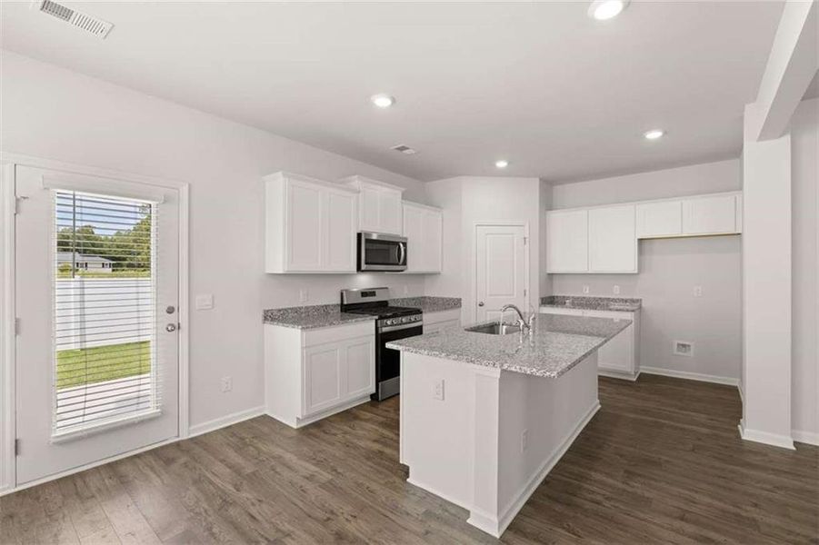 Furnished interior view inside a new home in Oakchase at Hampton, Hampton (Image 11).