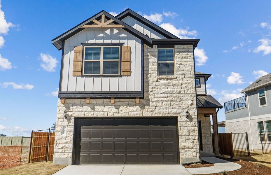 Front exterior of a new home in Santa Rita Ranch, Liberty Hill, TX, highlighting curb appeal (Image 22).