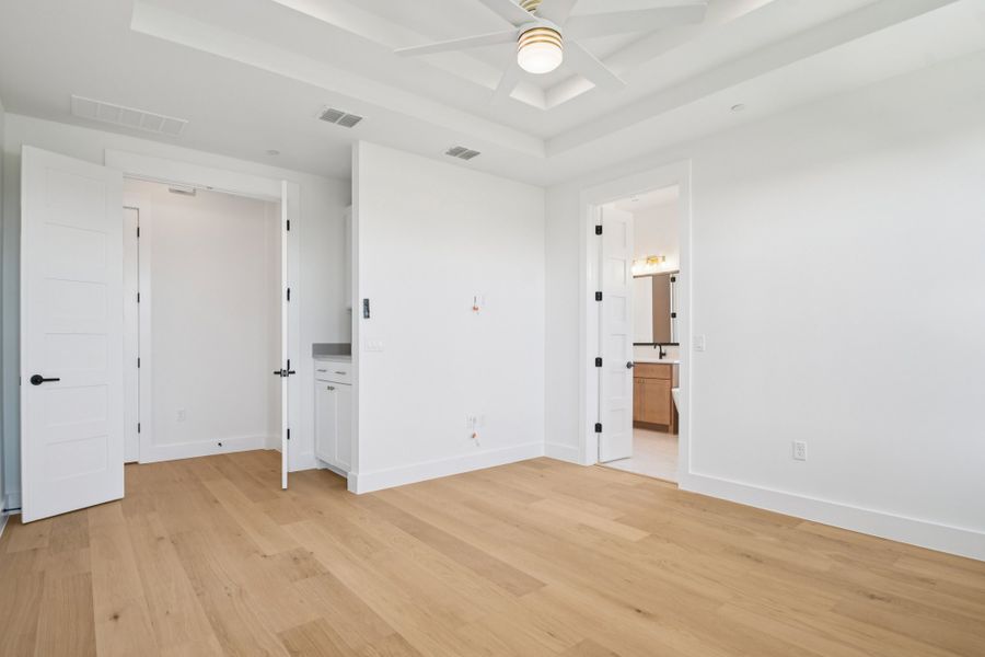Spacious, unfurnished interior of a new home in Milky Way at River Place, Austin (Image 36).