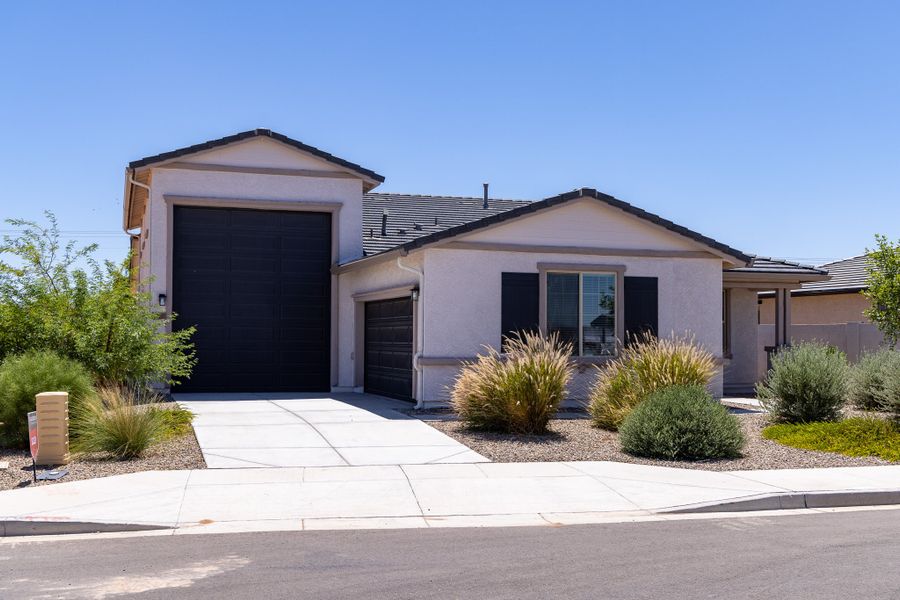 Front exterior of a new home in Rancho Mirage, Maricopa, AZ, highlighting curb appeal (Image 1). Front exterior of a new home in Rancho Mirage, Maricopa, AZ, highlighting curb appeal (Image 1).