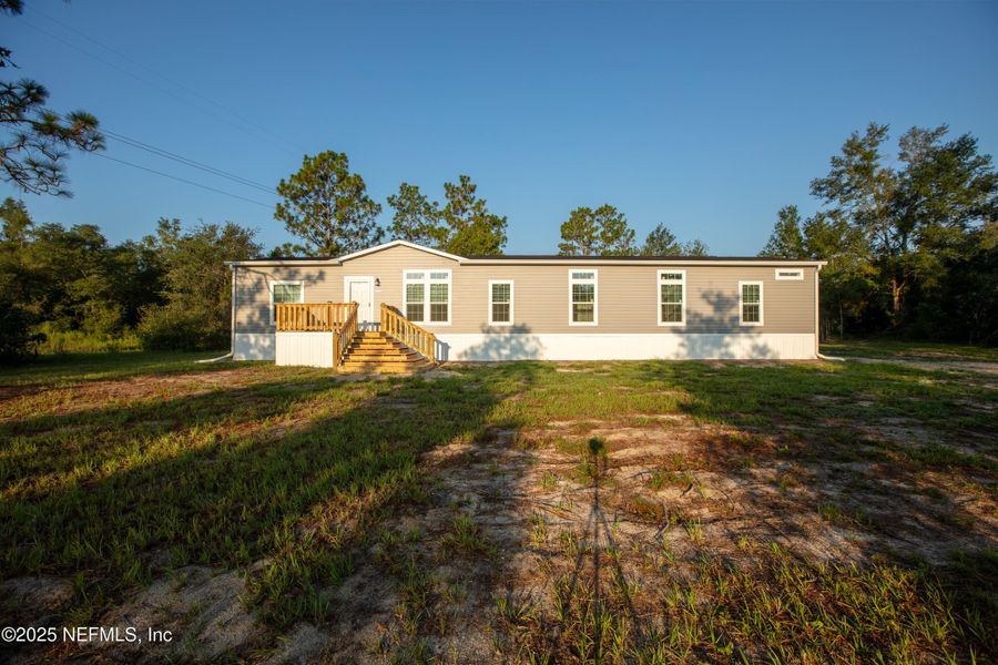 Front exterior of a new home in , Keystone Heights, FL, highlighting curb appeal (Image 25). Front exterior of a new home in , Keystone Heights, FL, highlighting curb appeal (Image 25).
