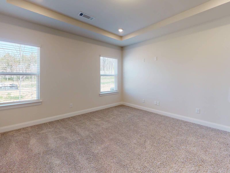 Large windows allow light to flood into the primary suite. Large windows allow light to flood into the primary suite.