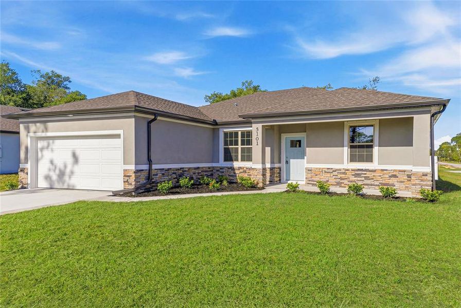 Front exterior of a new home in , North Port, FL, highlighting curb appeal (Image 2). Front exterior of a new home in , North Port, FL, highlighting curb appeal (Image 2).