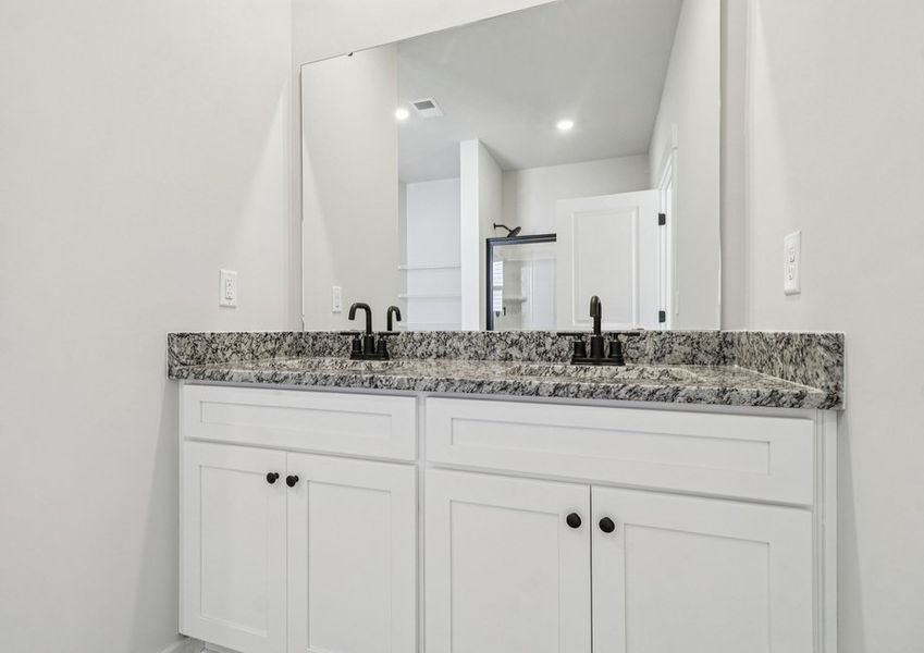 The master bathroom has double sinks