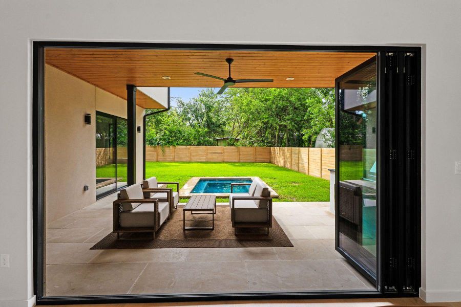 Retreat to a private outdoor oasis with a compact pool and comfortable patio seating. Retreat to a private outdoor oasis with a compact pool and comfortable patio seating.