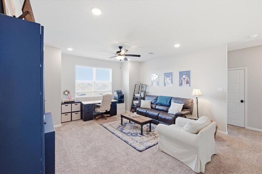 2nd living room featuring light carpet, a ceiling fan, with recessed and natural lighting 2nd living room featuring light carpet, a ceiling fan, with recessed and natural lighting