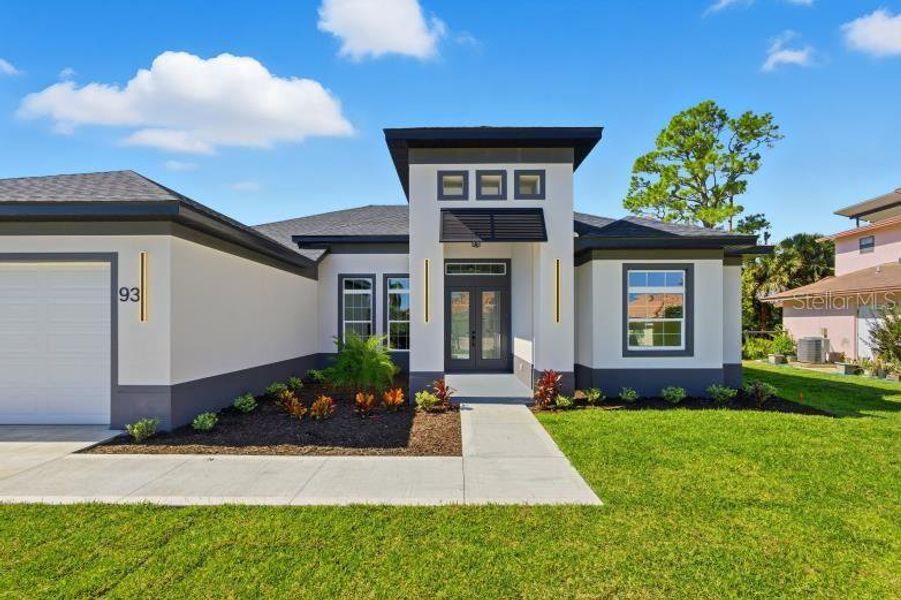 Front exterior of a new home in , Palm Coast, FL, highlighting curb appeal (Image 25).