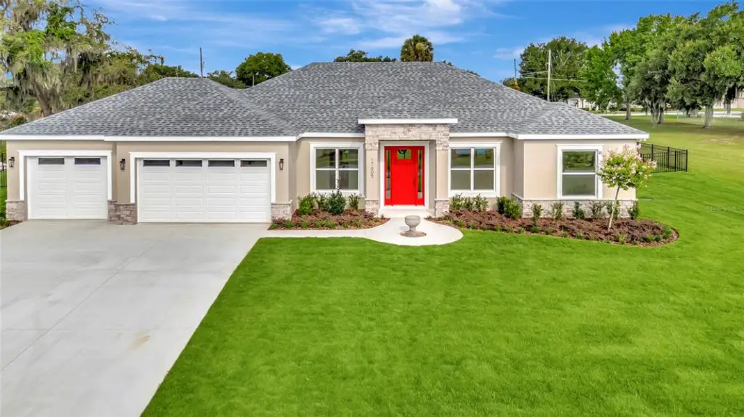 Front exterior of a new home in , Montverde, FL, highlighting curb appeal (Image 18). Front exterior of a new home in , Montverde, FL, highlighting curb appeal (Image 18).