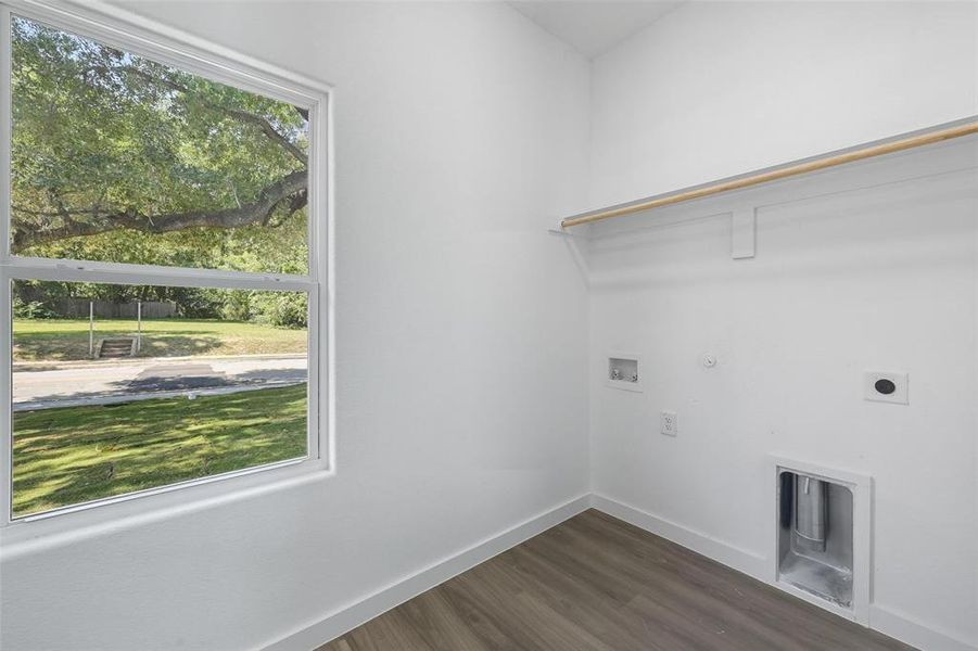 Laundry area featuring gas dryer hookup, dark wood finished floors, hookup for a washing machine, and electric dryer hookup Laundry area featuring gas dryer hookup, dark wood finished floors, hookup for a washing machine, and electric dryer hookup