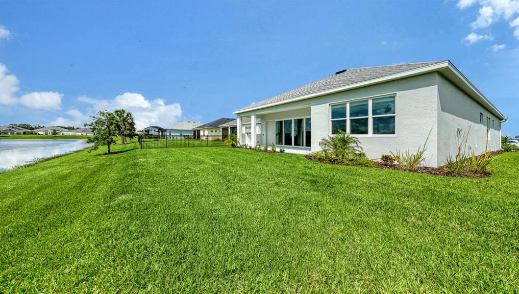Exterior details and patio area of a home in Canoe Creek, Parrish (Image 18).