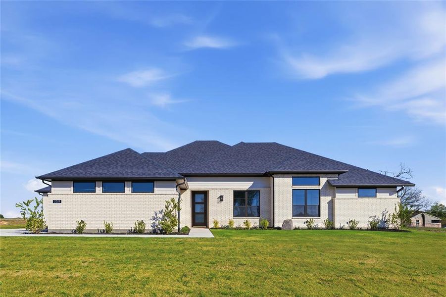 Front exterior of a new home in Waterfall Ranch, Waxahachie, TX, highlighting curb appeal (Image 1). Front exterior of a new home in Waterfall Ranch, Waxahachie, TX, highlighting curb appeal (Image 1).