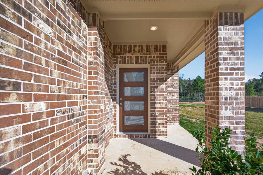 Exterior details and patio area of a home in Enclave at Willis, Willis (Image 4).