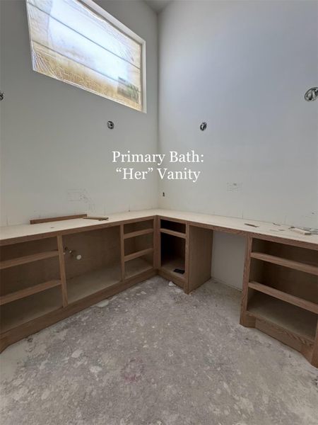Dedicated 'Her' Vanity in the Primary Bath, designed with Custom Cabinetry and ample counter space for a private, elegant beauty station.