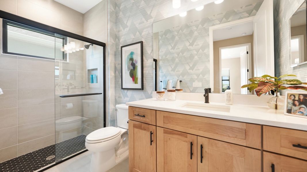 Representative furnished interior of a home built from the Artistry by Neal Communities in SkySail, Naples (Image 29).