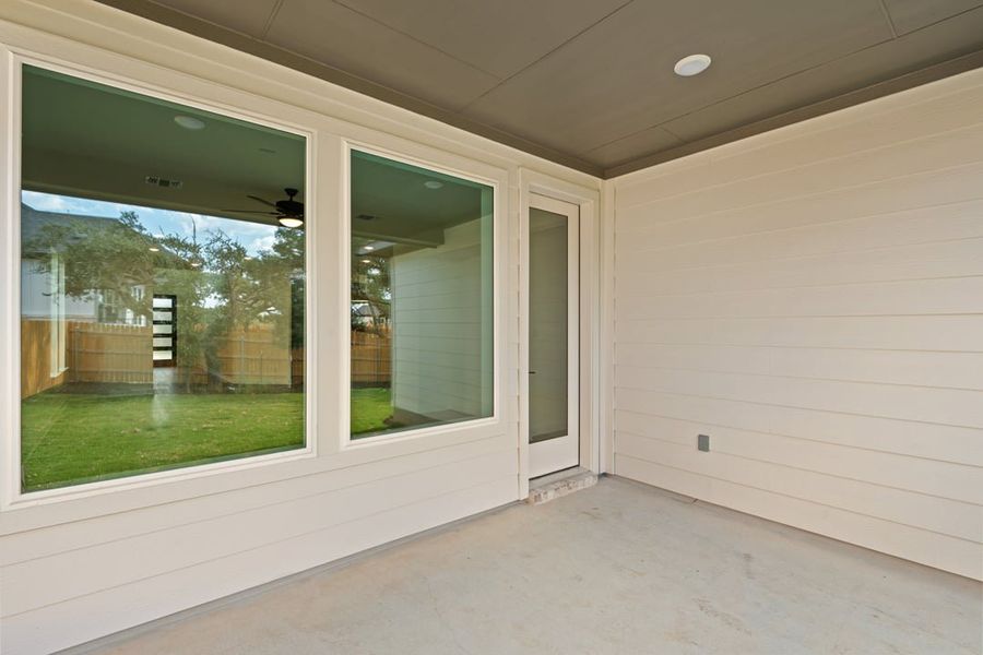 Exterior details and patio area of a home in Terrace Collection at Heritage, Dripping Springs (Image 26).