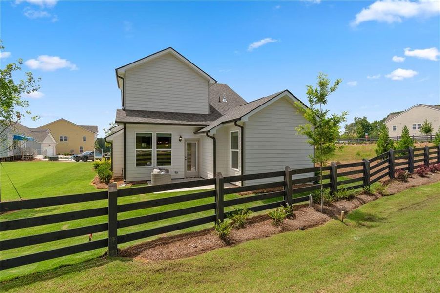 Front exterior of a new home in Abbotts Crossing, Conyers, GA, highlighting curb appeal (Image 19).