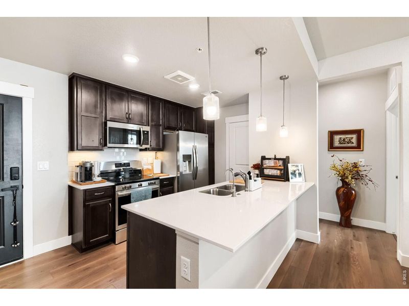 Furnished interior view inside a new home in Highlands at Fox Hill - The Flats, Longmont (Image 12).