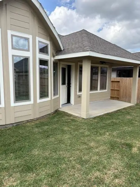 Exterior details and patio area of a home in , Spring (Image 3).