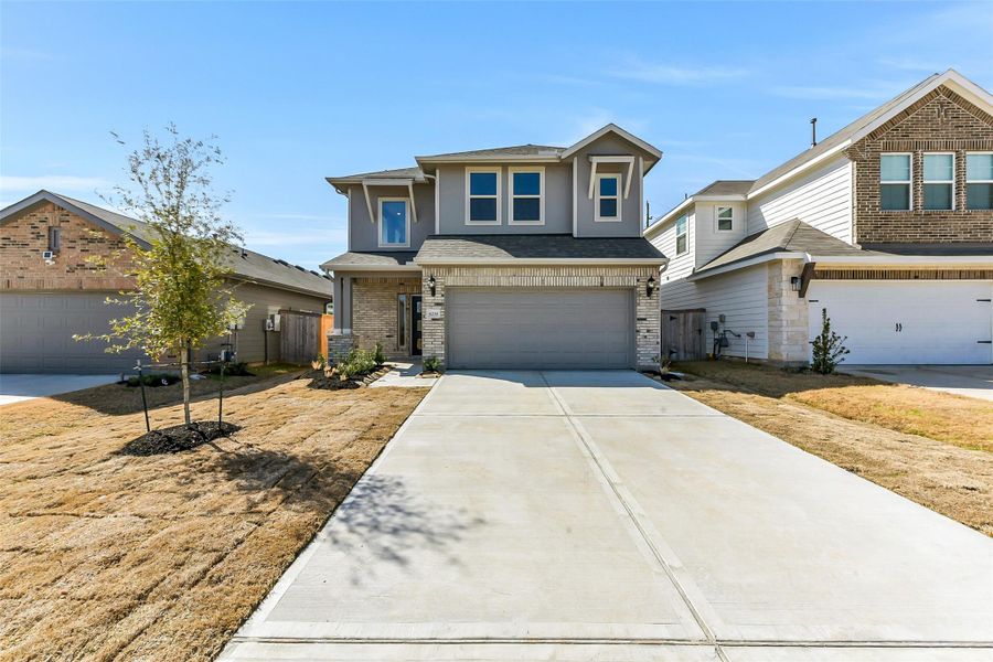 Front exterior of a new home in Colony at Pinehurst, Pinehurst, TX, highlighting curb appeal (Image 26).