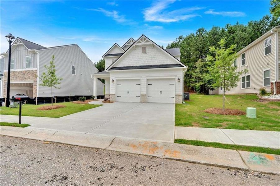 Front exterior of a home in the The View at Groover's Lake community, located in Lithia Springs, GA (Image 12).