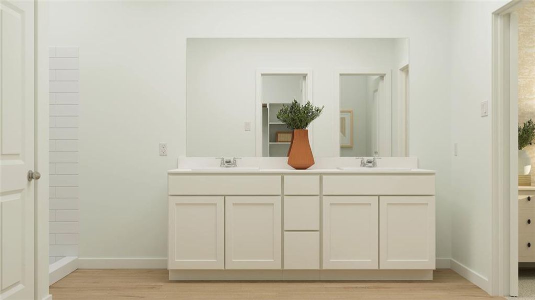 Bathroom featuring vanity and wood-type flooring