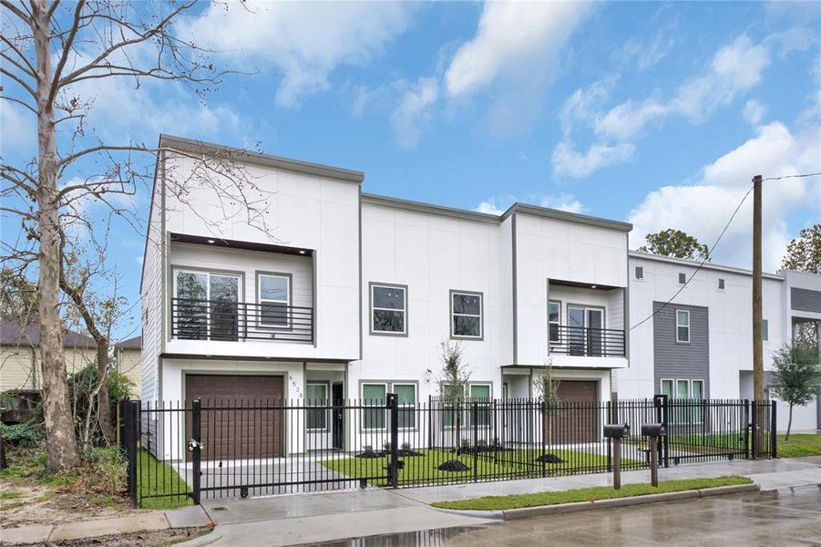 Fully fenced, wrought iron with motorized sliding gate on the front