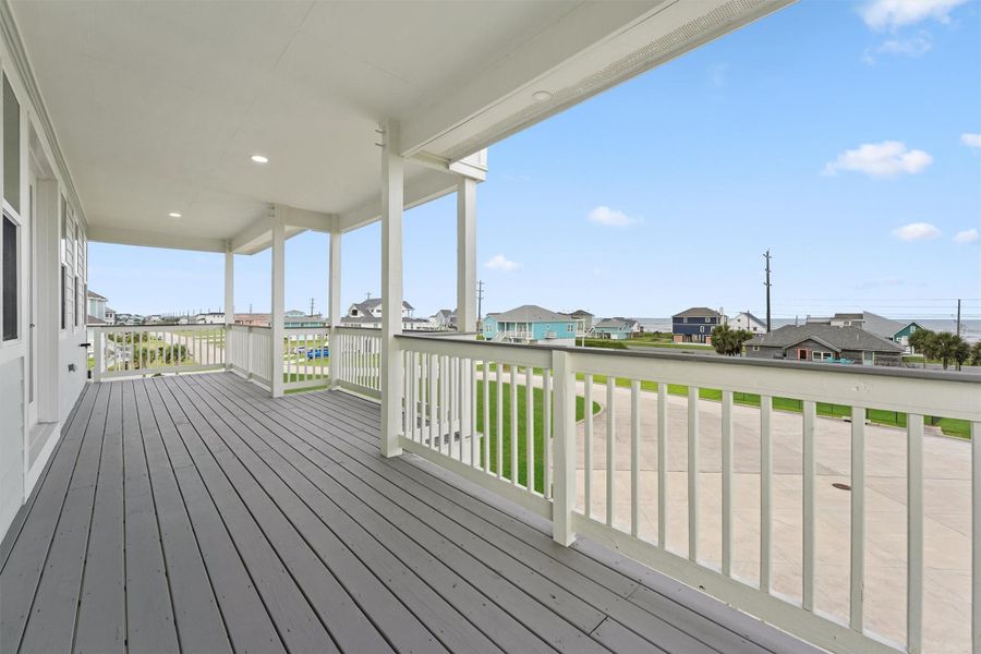 First level covered deck offers a relaxing spot to enjoy beach breezes and sunrise views in total privacy. First level covered deck offers a relaxing spot to enjoy beach breezes and sunrise views in total privacy.