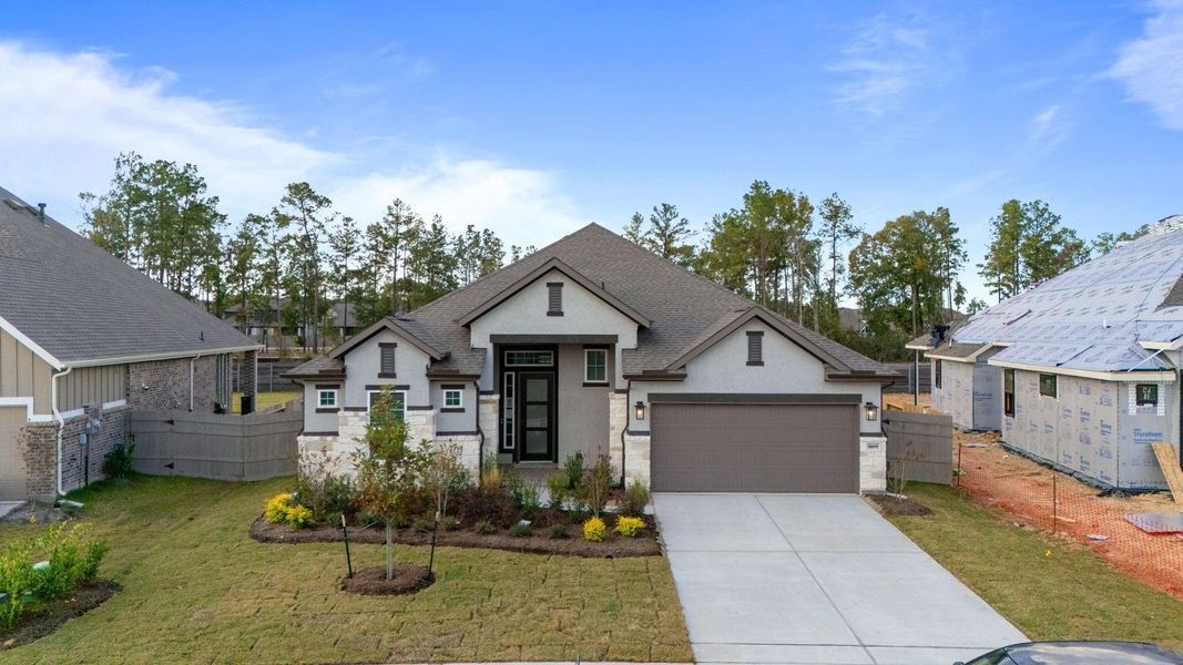 Front exterior of a new home in Artavia, Conroe, TX, highlighting curb appeal (Image 2). Front exterior of a new home in Artavia, Conroe, TX, highlighting curb appeal (Image 2).